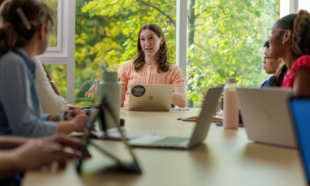 A student leads a group discussion